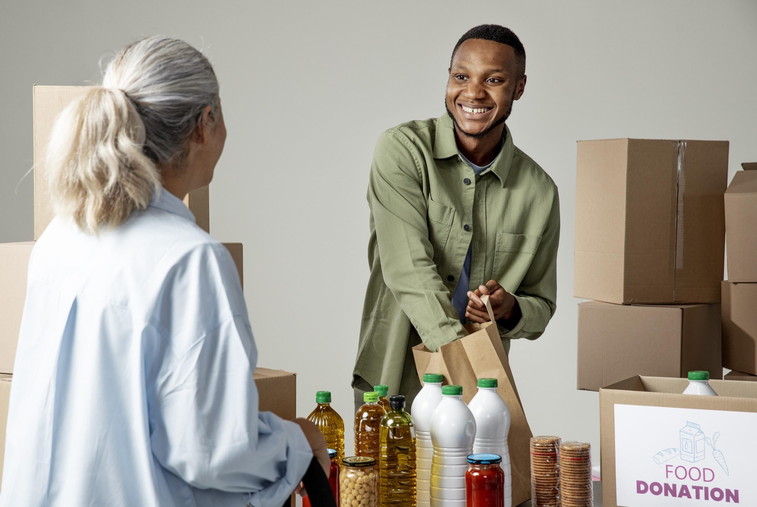 medium-shot-smiley-man-holding-paper-bag